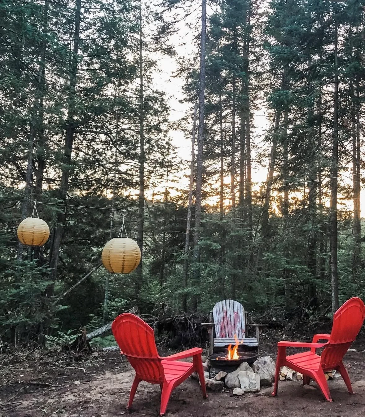 Fire pit area with Adirondack chairs, summer