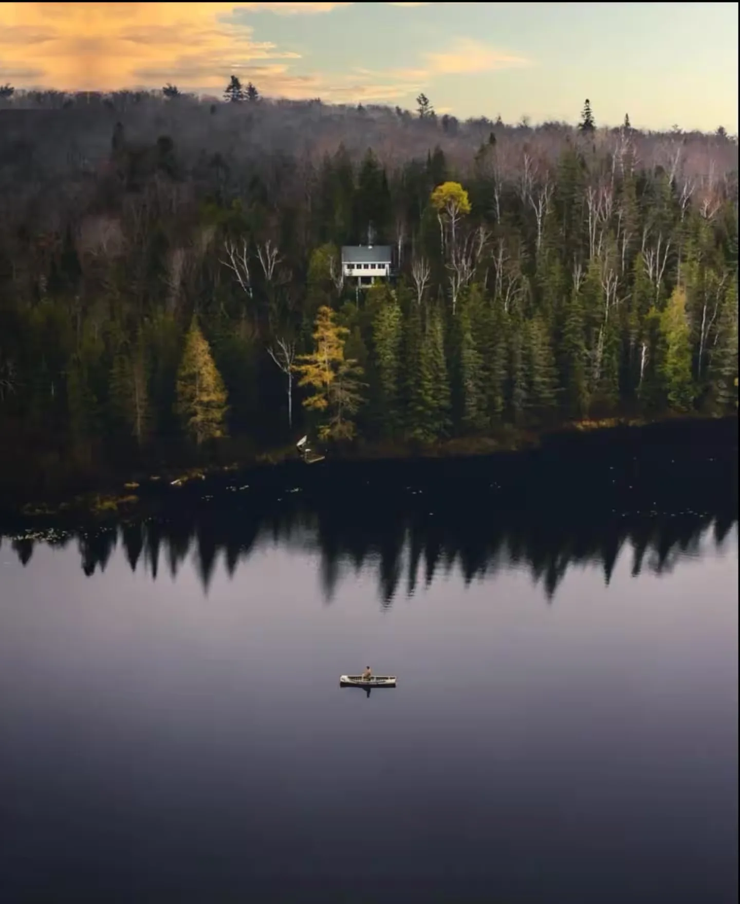 Aerial view of the Off Grid Cabin nestled in forest above Little McGarry Lake